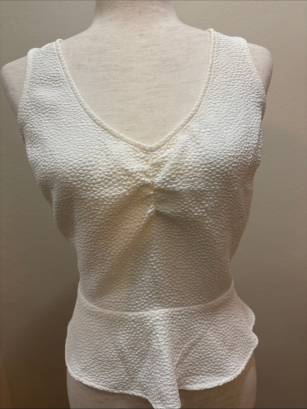 Express Textured off white Sleeveless V neck Peplum Top